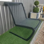 Close-up of AS-3 steel rod slats with rounded edges and even spacing