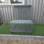 AS-3 park bench installed outdoors on paving in a public plaza