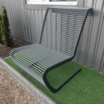 outdoor bench — front view showing steel-rod backrest and seat on a cantilevered frame